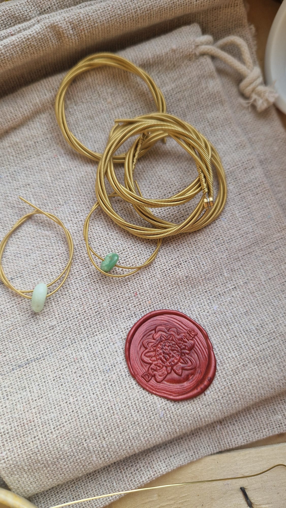 Some guitar strings in the process of being crafted to jewellery